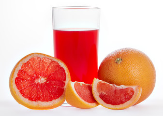 Glass of pink grapefruit juice over white background.