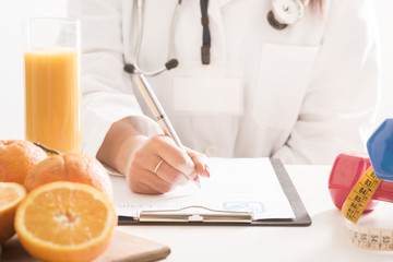 Nutrionist doctor writing 