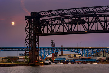 Full moon rising over the bridges over the Cuyahoga in Cleveland Ohio