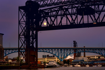 Full moon shining through a railroad lift bridge in Cleveland Ohio