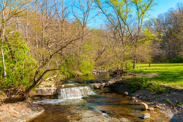 Fototapeta premium A small waterfall on Hemlock Creek in Bedford Reservation, Cleveland Ohio metroparks