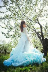 beautiful woman in dress in the gardens