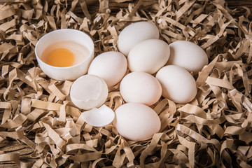 duck egg and Egg yolks in a bowl on straw paper