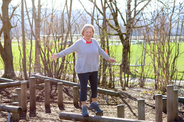Senior woman balancing in park