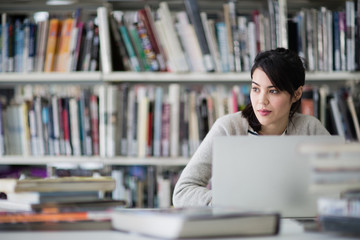 Student using laptop in library
