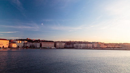 sunset in front of the city of Trieste