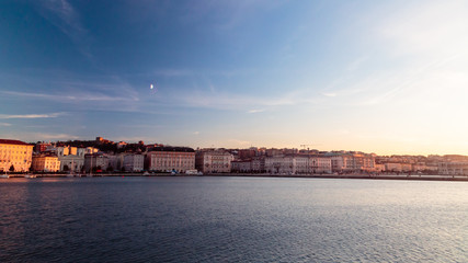 Fototapeta premium sunset in front of the city of Trieste