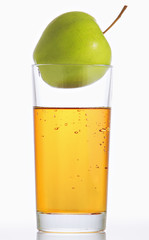 Glass of apple juice and apples.