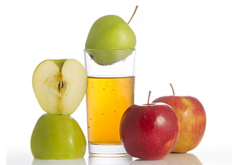 Glass of apple juice and apples.
