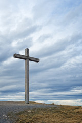 Wooden cross on mountain peak