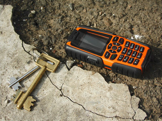 An armor-piercing mobile phone on the ground.