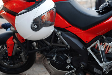 Fototapeta na wymiar Moto helmet on the handlebars of the motorcycle