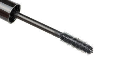 Black brush mascara on a white background, close-up
