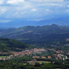 Urbania, Italy - August, 1, 2016: mountain landscape with a view of a small town Urbania in a North Italy