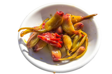 Marinated garlic on a white plate