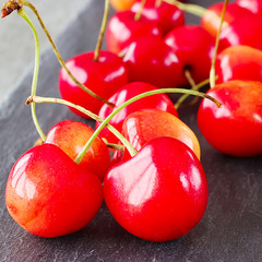 A fresh cherries on a gray background