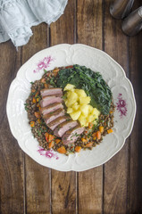 Roast duck with lentils and apples