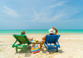 Couple on the beach at tropical resort Travel