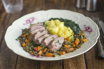 Roast duck with lentils and apples
