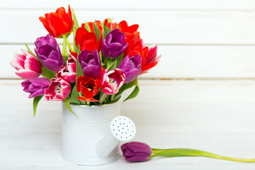 Tulip bouquet on  wooden background, copy space