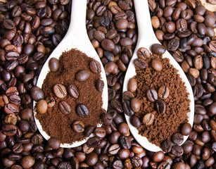 Iinstant coffee in spoon on coffee beans background