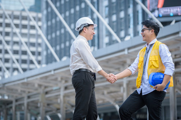 Engineer and leader worker people shake hand for agree job