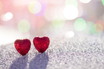 Two heart on a background of bright light