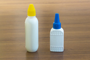 empty blank two bottles or vials on wood background