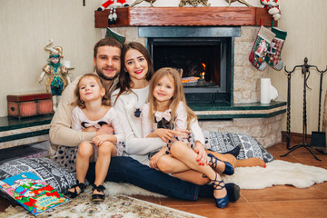 Extended Family Relaxing Together at the fireplace