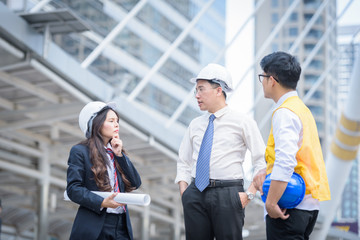 woman engineer standing think something with architects engineer