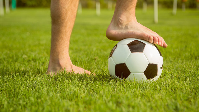 man barefoot on soccer ball outdoor prepare to play friendly match