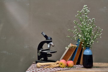 still life art photography on human bone with book