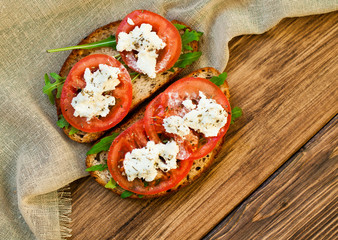 Sandwich with Feta cheese and tomatoes. Fast food, cafe banner