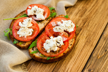 Sandwich with Feta cheese and tomatoes. Fast food, cafe banner
