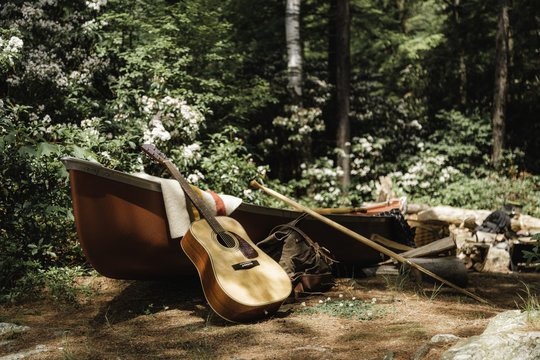 Guitar and canoe still life