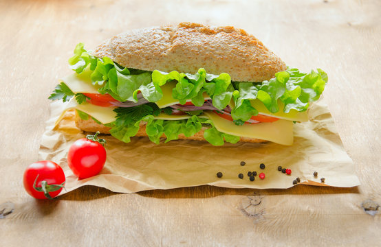 Vegan sandwich with cheese, vegetables and greens