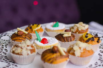 many sweet birthday cupcakes with cream