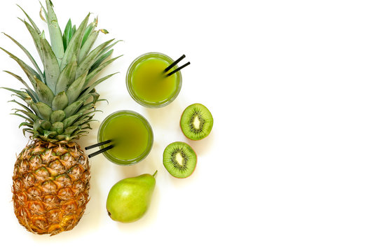 Two glasses of kiwi, pineapple, pear juice isolated on white and ingredients.