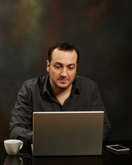 Man working on a laptop.