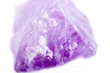 Macro Mineral Stone Amethyst on a white background