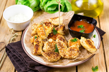 Healthy chicken nuggets with sesame seeds