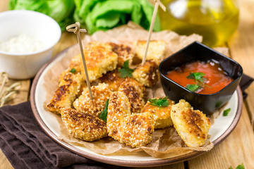 Healthy chicken nuggets with sesame seeds