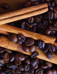 Cinnamon sticks on coffee beans.