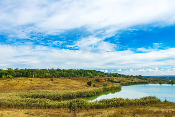 landscape, pond and forest on the hills, nature background