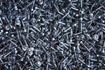 large number of screws with washer on them