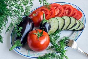 Tomato and aubergine, sliced. Fresh dill. Preparation of a vegetable dish ratatouille.