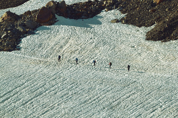 Group of Tourists on the Snowfield