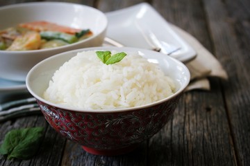 Thai jasmine rice served with Shrimp green curry sauce, selective focus