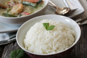 Thai jasmine rice served with Shrimp green curry sauce, selective focus