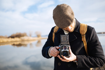 Photographer with vintage photo camera
